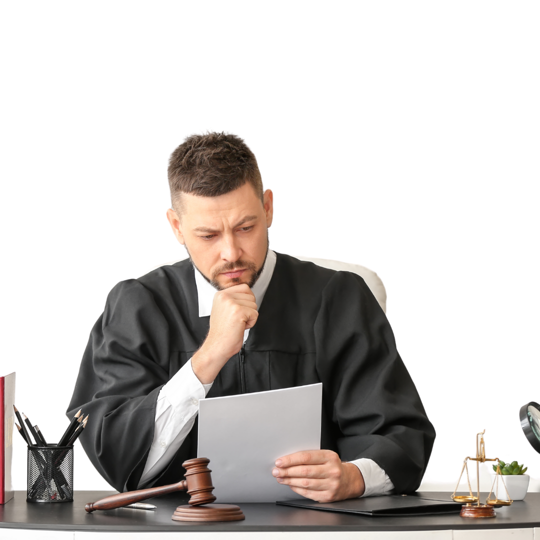 A lawyer reading papers at desk