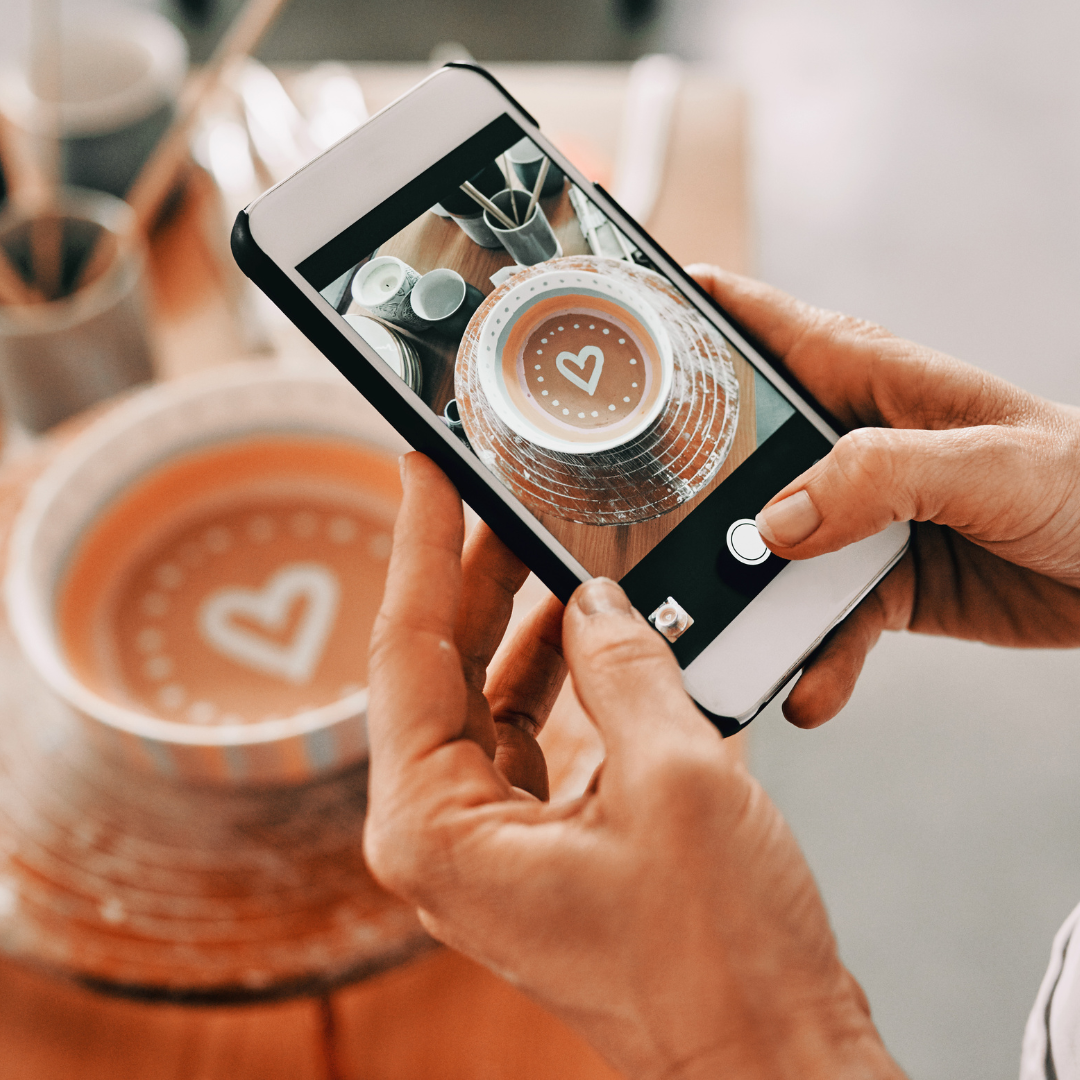 Image of a coffee cup photo being taken with a smart phone