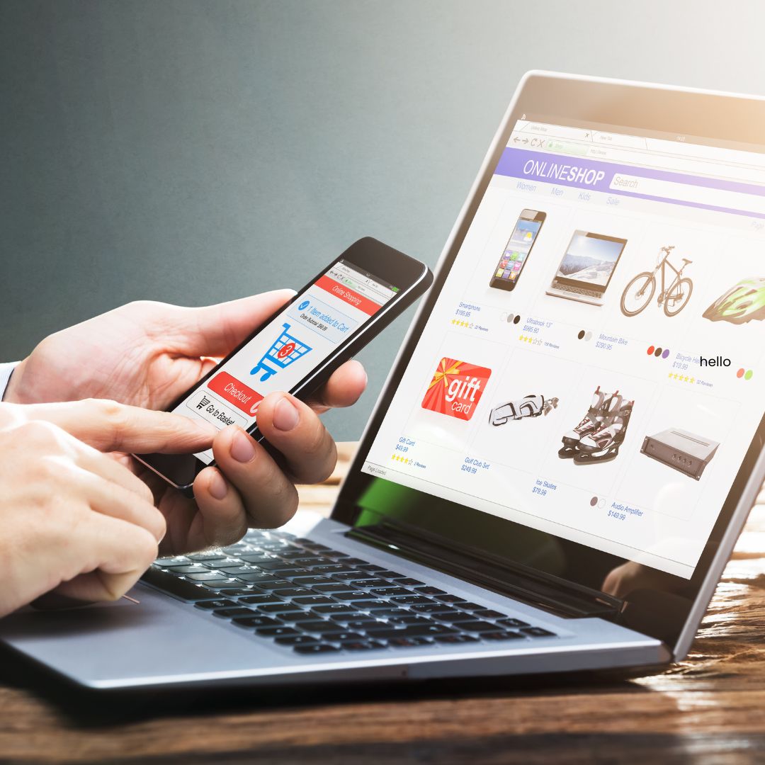 Image of someone checking a website on a laptop and mobile